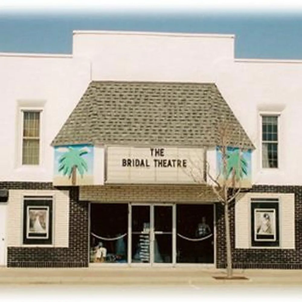 The Bridal Theatre storefront with painted palm trees on the marquee